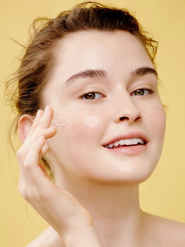 Abgebildet ist eine lächelnde Frau