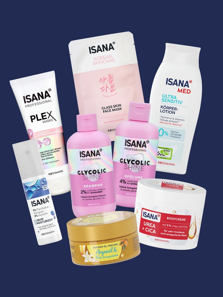 ISANA Produktgruppe auf dunkelblauem Hintergrund mit Plex Maske, Glycolic Shine Haarpflege, Korean Skincare Maske, Med Körperlotion, Liquid Moisturizer, Zucker-Öl-Peeling und Bodycreme Urea + Cica
